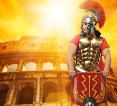 Roman legionary soldier in front of coliseum clipart