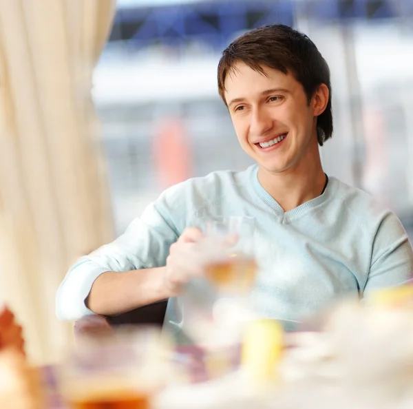 Happy man in a restaurant — Stock Photo, Image
