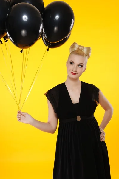 Lovely lady with black balloons — Stock Photo, Image