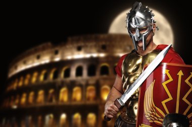 Roman legionary soldier in front of coliseum at night time clipart