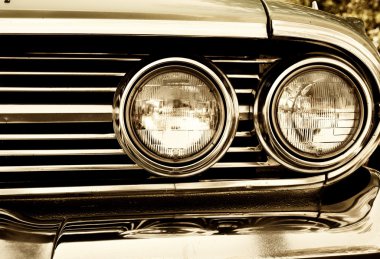 Close-up photo of retro car headlights clipart