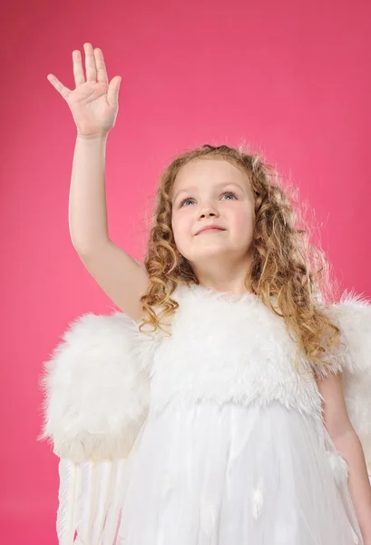 Beautiful little angel girl isolated on pink background — Stock Photo, Image