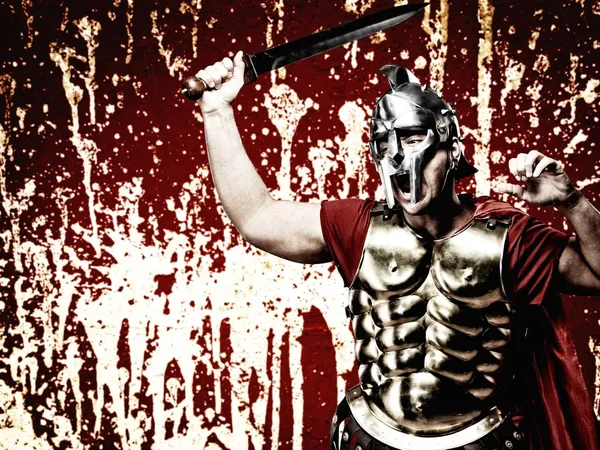 Legionary soldier over abstract bloody wall — Stock Photo, Image