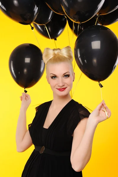 Lovely lady with black balloons — Stock Photo, Image