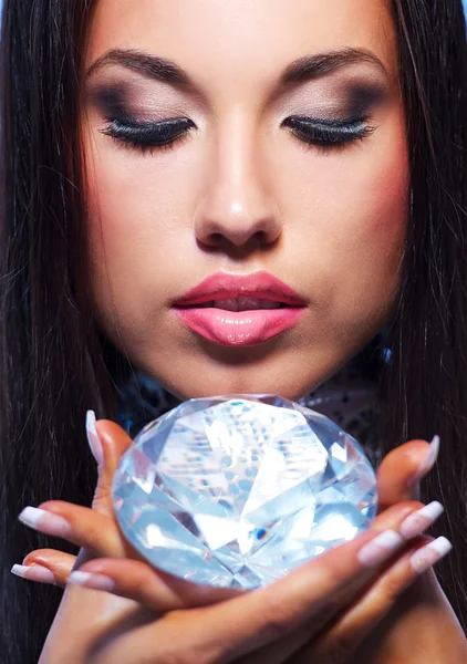 Close-up portrait of a beautiful woman with a diamond — Stock Photo, Image