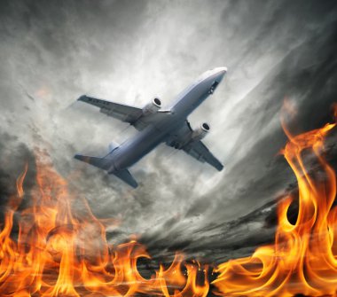 Airplane flying over burning sky clipart