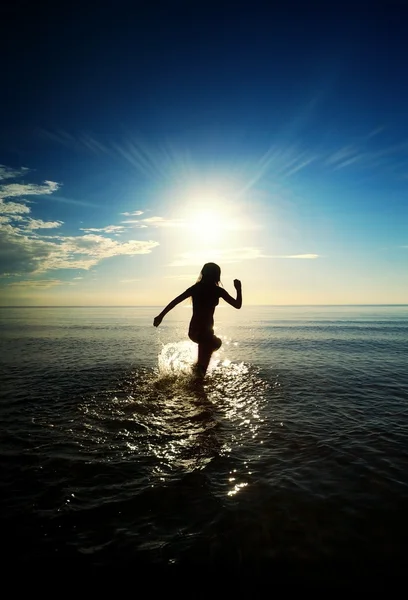Happy girl running in the sea — Stock Photo, Image