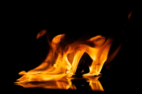 stock image Fire flames reflected in water