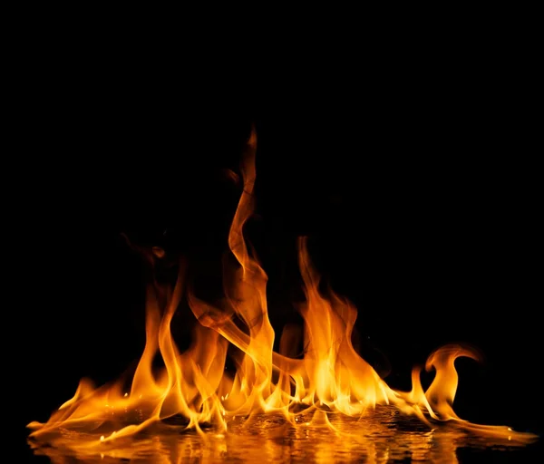 Fire flames reflected in water — Stock Photo, Image