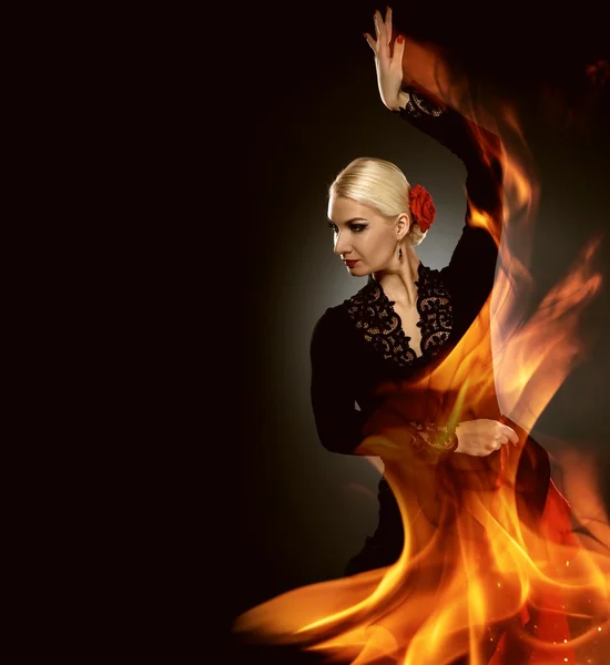 Beautiful flamenco dancer in the fire flames — Stock Photo, Image