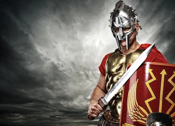 Legionary soldier over stormy sky — Stock Photo, Image