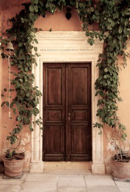 Wooden door of an ancient house clipart