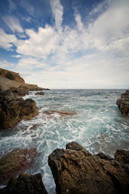 Ocean vawes breaking the rocks clipart