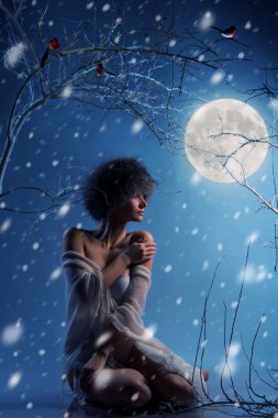 Attractive woman in winter forest clipart