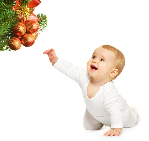 Очаровательный ребенок с рождественской игрушкой — стоковое фото