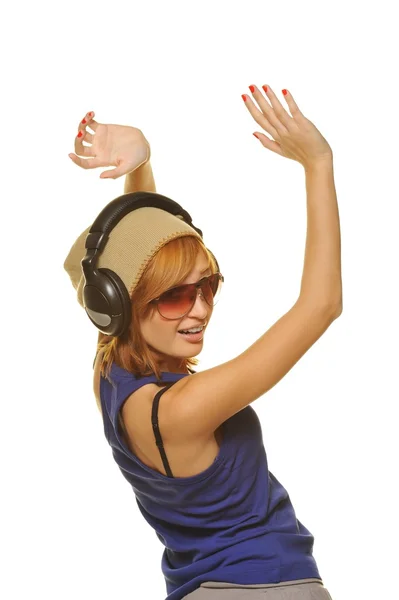 Stijlvolle dansende meisje met koptelefoon — Stockfoto