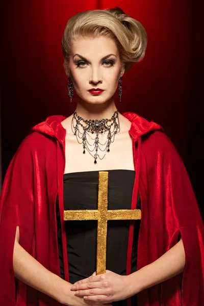 Attractive blond lady with a golden cross — Stock Photo, Image