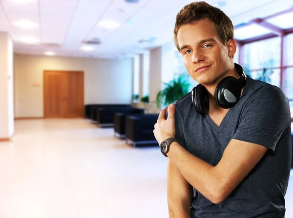 Handsome men with headphones indoors — Stock Photo, Image