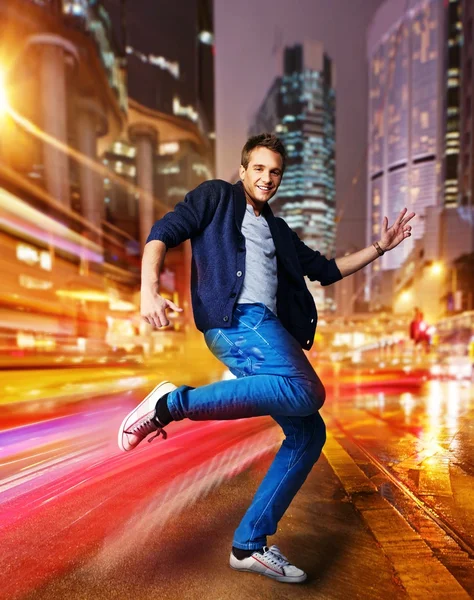 Stylish young dancer in the night city — Stock Photo, Image