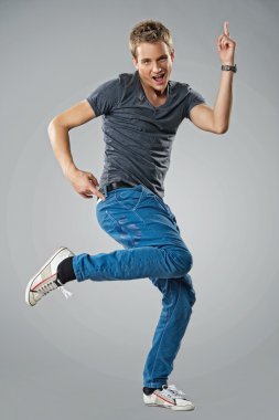 Handsome young man dancing clipart