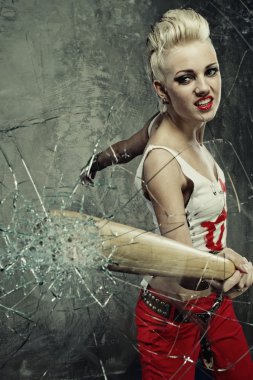 Punk girl broking a glass with a bat clipart