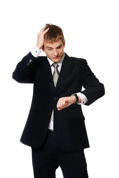 Uomo d'affari confuso guardando orologio — Foto Stock