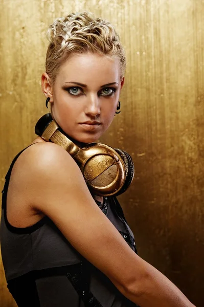 Portrait of an attractive steam punk girl with headphones — Stock Photo, Image