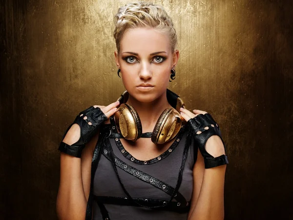 Portrait of an attractive steam punk girl with headphones — Stock Photo, Image
