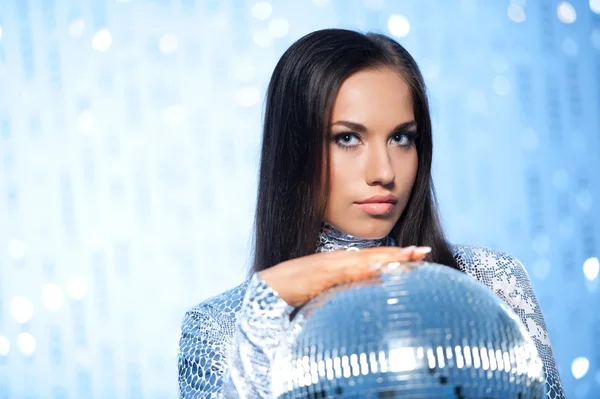 Stylish brunette with a disco ball — Stock Photo, Image