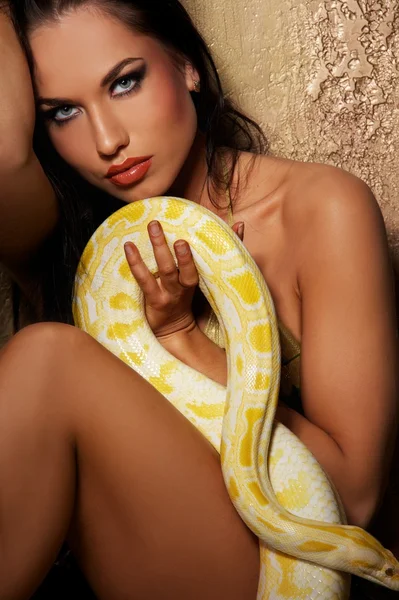 Attractive brunette woman with python — Stock Photo, Image
