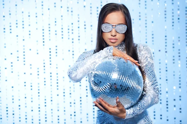 Stylish brunette with a disco ball Stock Image