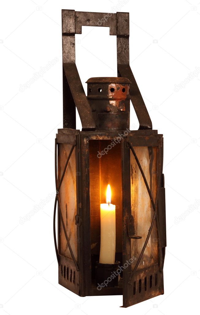 Old lamp with burning candle