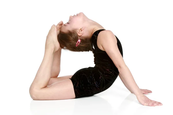 Dziewczyna wykonuje proste ćwiczenia gimnastyczne — Zdjęcie stockowe