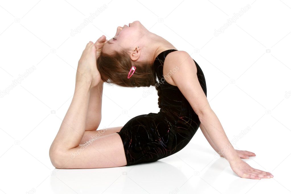 Girl performs simple gymnastic exercises ⬇ Stock Photo, Image by © 5467784