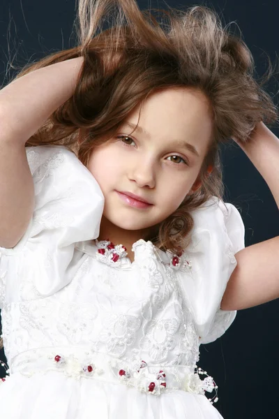 Adorable little girl on dark background. — Stock Photo, Image