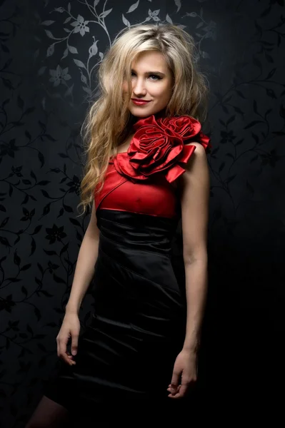 Blonde in a red gown — Stock Photo, Image