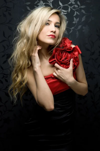 Blonde in a red gown — Stock Photo, Image