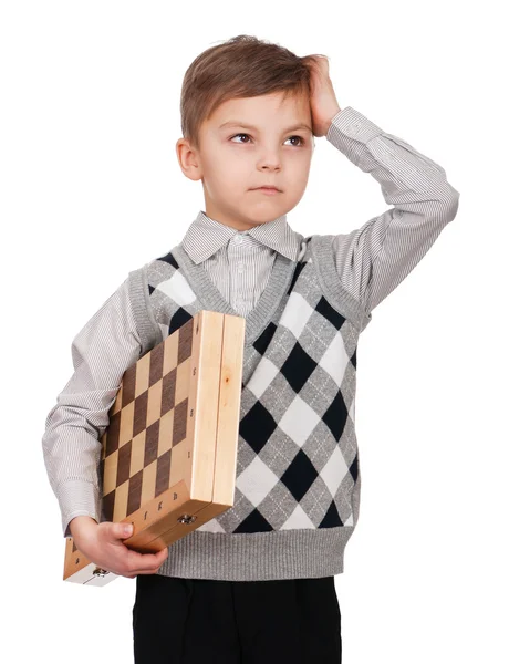 Niño con tablero de ajedrez —  Fotos de Stock