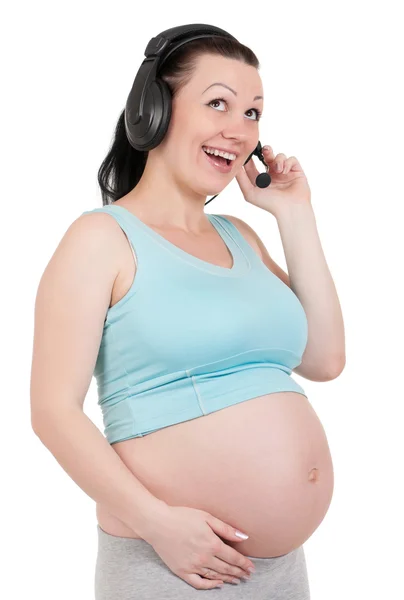 Embarazada con auriculares —  Fotos de Stock