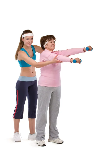 Senior woman exercising in gym — Stock Photo, Image