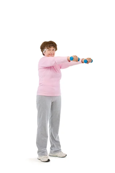 Senior woman exercising with dumbells — Stock Photo, Image
