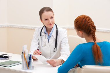 Doctor advises woman patient clipart