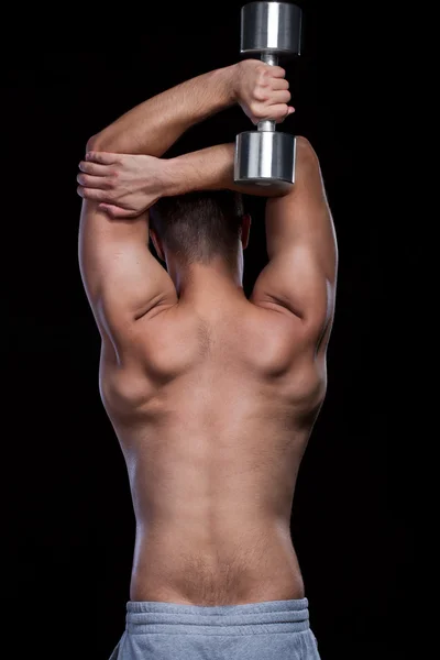 Male back doing fit exersices with dumbbell — Stock Photo, Image