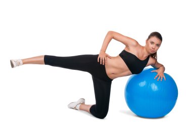 Strong girl excersicing with fitball