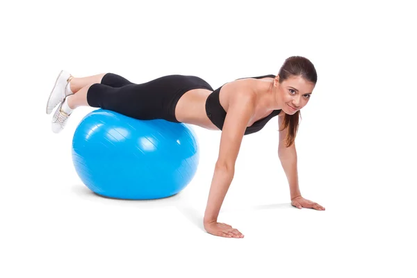 Strong girl excersicing with fitball — Stok fotoğraf