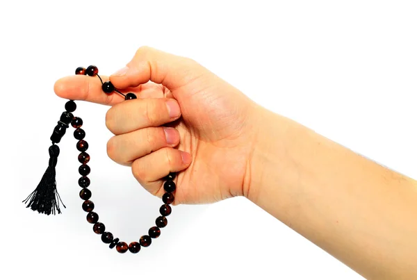Gros plan d'une main tenant une chaîne de prière — Photo
