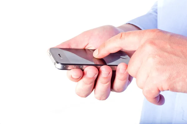 Hand hålla en smart telefon — Stockfoto