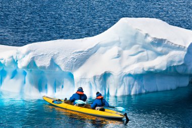 Two men in a canoe clipart