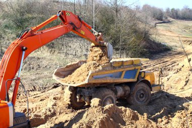 Backhoe loader loading dumper clipart