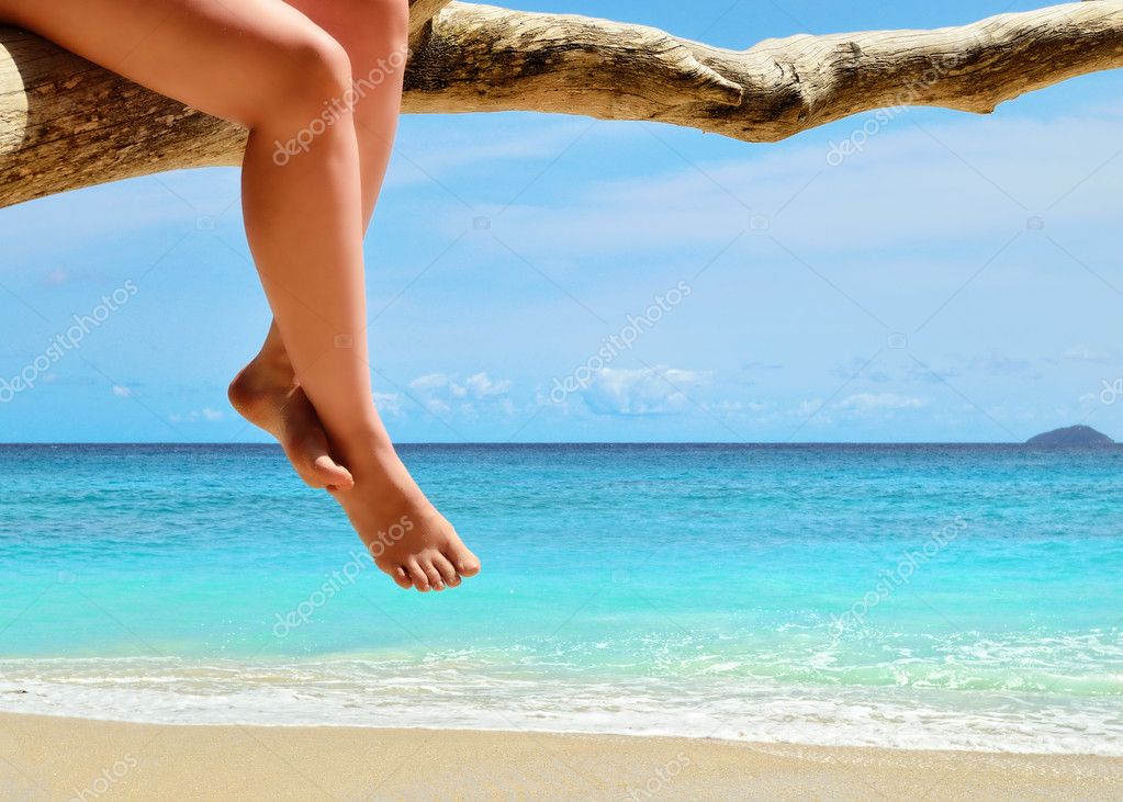 Sand Beach Azure Sea And Woman Legs Stock Photo Znm